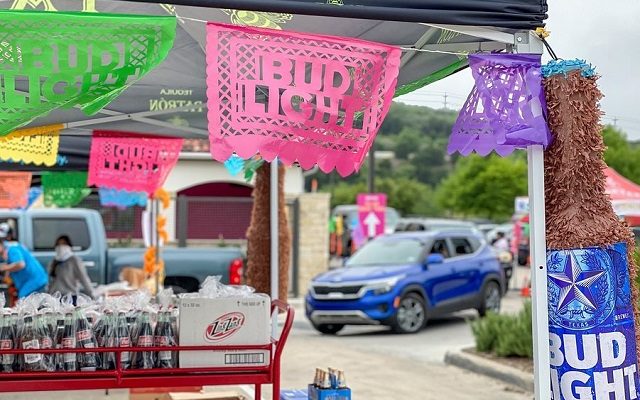 Drive-thru fiesta features food booths, music and parade floats