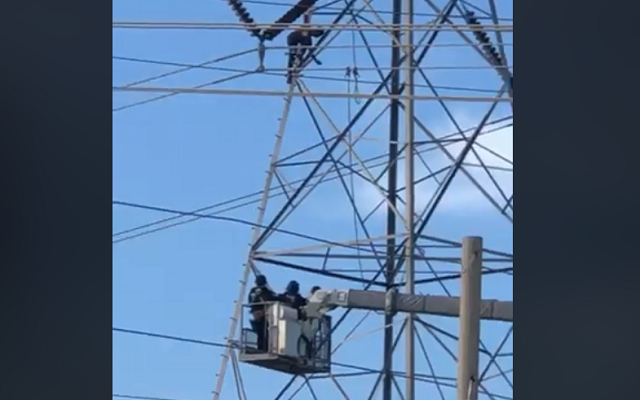 Man climbs transmission tower in Northeast San Antonio, hangs on for 3 hours
