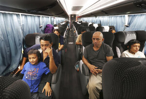 Suburbs put the brakes on migrant bus arrivals after crackdowns in Chicago and New York