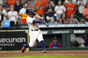Altuve slam in 10th lifts Astros over Rangers on Baker B-day